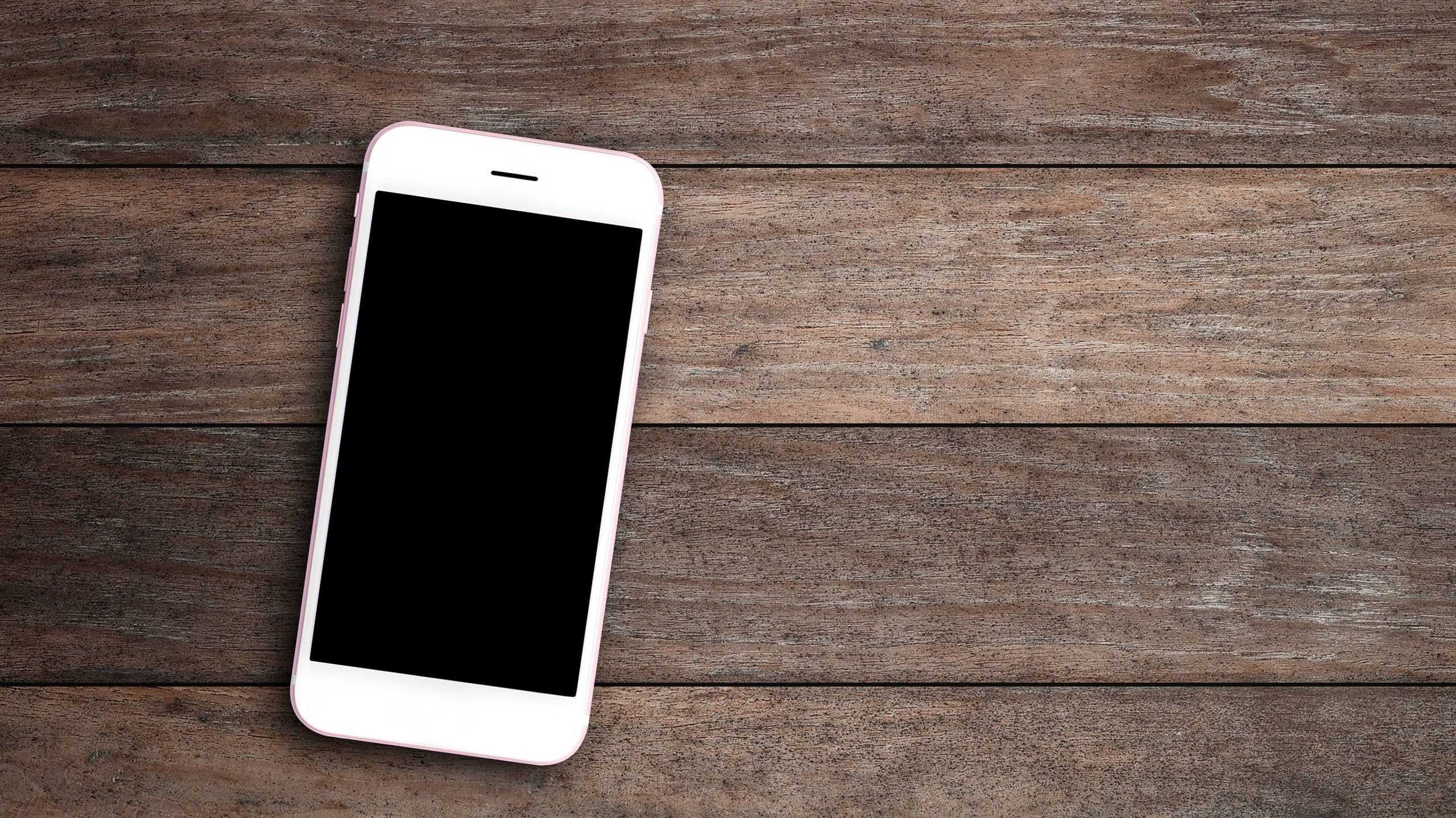 cellphone on a wood table